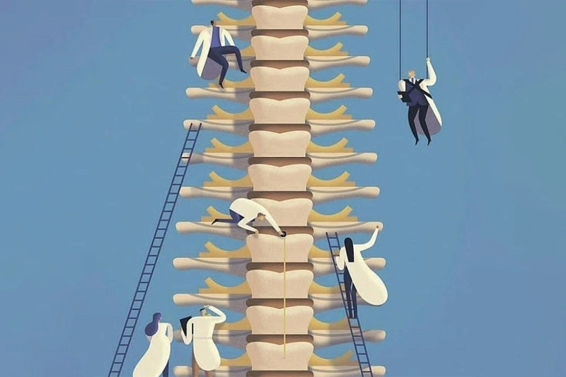 تصویری از گروهی کایروپراکتر در حال پژوهش روی ستونفقراتی غولپیکر شبیه ساختمان